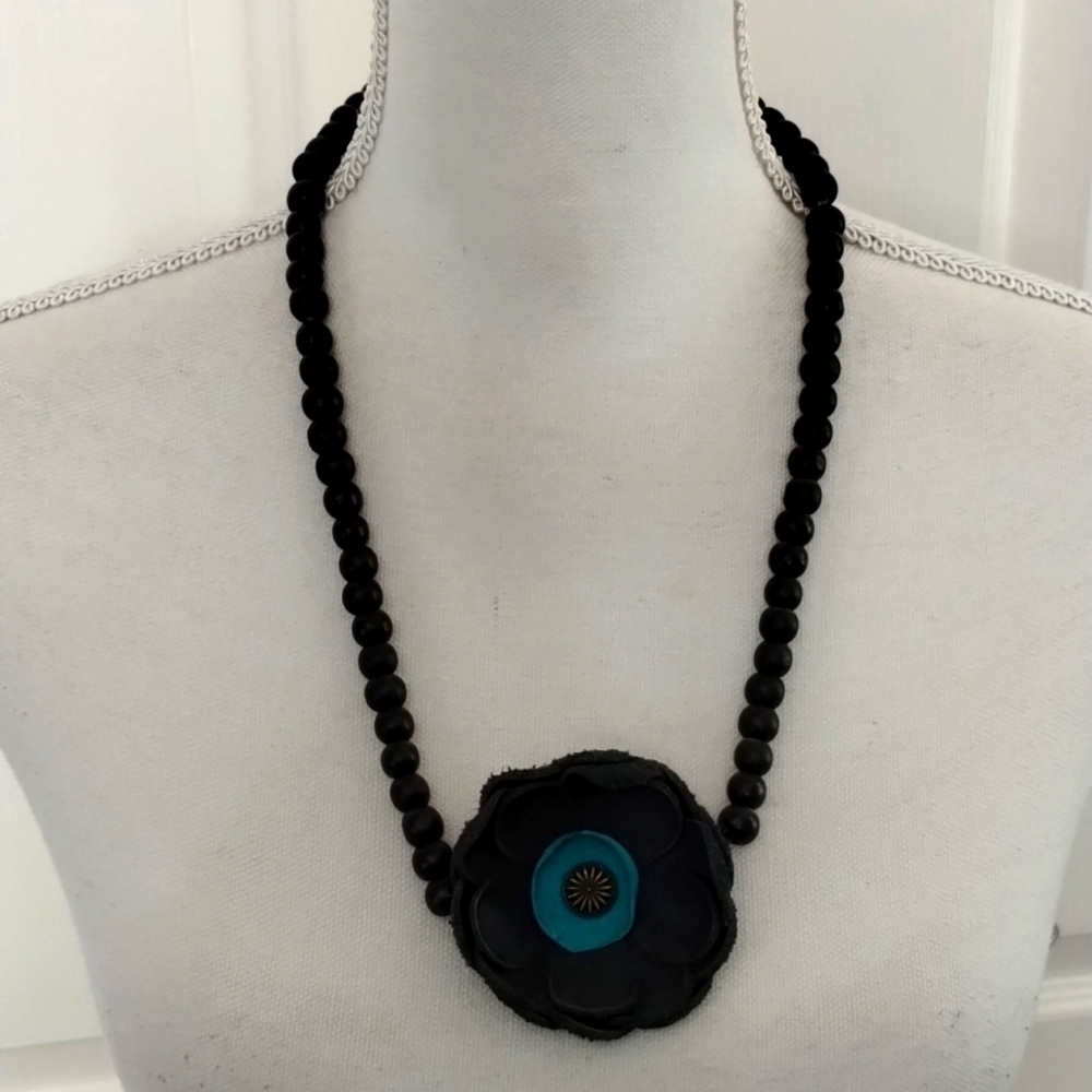 Women's black beaded slip over head necklace with handmade leather flower